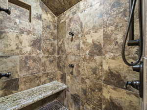 Full bathroom with a tile shower