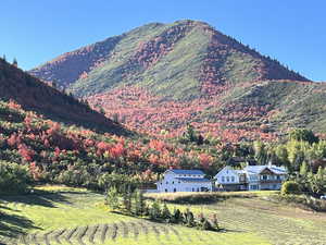 View of mountain backdrop featuring rural landscape and extensive farmland