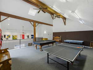 Game room featuring a ceiling fan, lofted ceiling, billiards, rail lighting, and a skylight