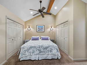 Bedroom featuring carpet flooring, ceiling fan, lofted ceiling, and recessed lighting