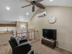 Living room featuring carpet flooring, a high textured ceiling, ceiling fan, and recessed lighting
