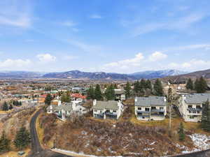 View of mountain backdrop with nearby suburban area