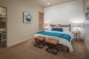 Carpeted bedroom with baseboards and recessed lighting