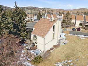Snowy aerial view featuring a mountain view