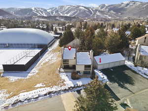 Snowy aerial view with a mountain view