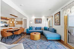 Living area featuring wood finished floors and recessed lighting