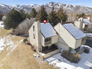 Snowy aerial view with a mountain view