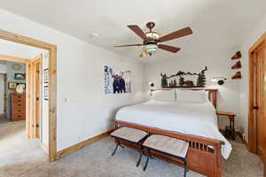 Bedroom with carpet and a ceiling fan