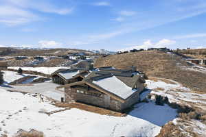 Snowy aerial view with a mountain view
