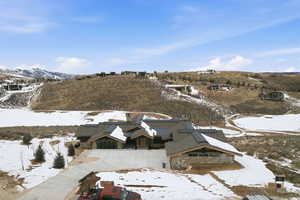 Snowy aerial view with a mountain view
