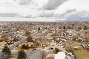 View of property location with nearby suburban area