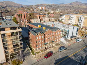 View of urban area featuring a mountainous background and apartment complex / building