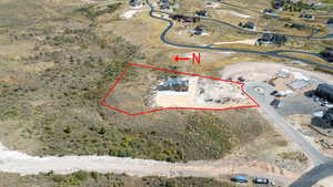 Aerial overview of property's location featuring property parcel outlined and a desert landscape