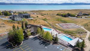 Aerial view of a water and mountain view and a pool area