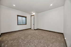 Unfurnished room featuring carpet and recessed lighting