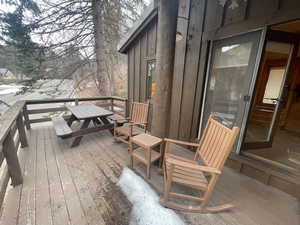 Wooden terrace featuring outdoor dining area