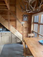 Dining area featuring wood walls