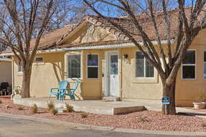 View of front of home featuring stucco siding
