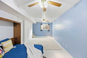 Bedroom featuring a ceiling fan, carpet floors, and a closet
