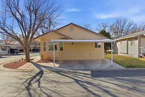 View of front of property with a front yard