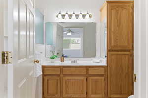 Bathroom featuring vanity and ceiling fan