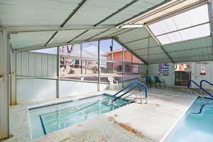 Indoor pool with a sunroom