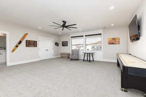 Game room with ceiling fan, light colored carpet, and recessed lighting