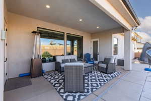 View of patio with outdoor furniture