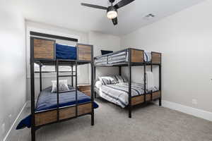 Bedroom with carpet and ceiling fan