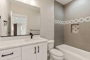 Full bathroom featuring vanity and washtub / shower combination