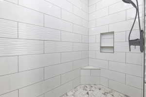 Full bath with tiled shower