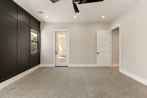 Unfurnished bedroom with light carpet, recessed lighting, a ceiling fan, and access to outside