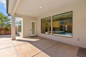 View of patio featuring an in-ground hot tub