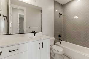 Full bathroom with vanity and washtub / shower combination