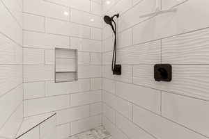 Bathroom view of a tile shower