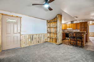 Living room with Pine bookcase. Wood finish cabinets, ceiling fan,