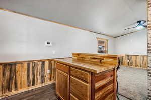 Kitchen area to living room. Island/bar gives you ample storage