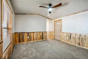 Living room with pine wainscoting and new carpet