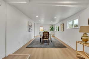 Dining area featuring light wood-type flooring and recessed lighting