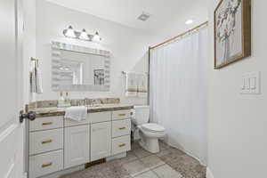 Full bathroom featuring vanity and light tile patterned flooring