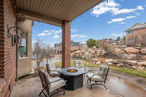 View of patio / terrace featuring an outdoor fire pit