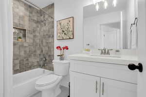 Full bath with shower / bathtub combination with curtain and vanity