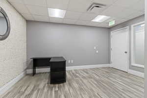 Unfurnished office with a drop ceiling