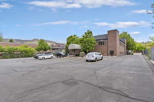 Uncovered parking lot featuring a mountain view