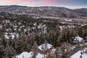 Snowy aerial view with a mountain view