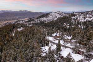 Snowy aerial view with a mountain view