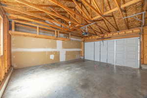 Garage featuring a garage door opener