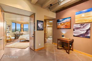 Hall with beamed ceiling and a mountain view