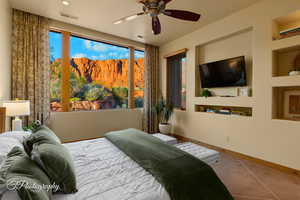 Bedroom featuring baseboards and ceiling fan