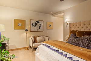 Tiled bedroom with baseboards